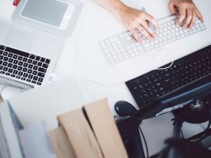 Free hands typing on keyboard
