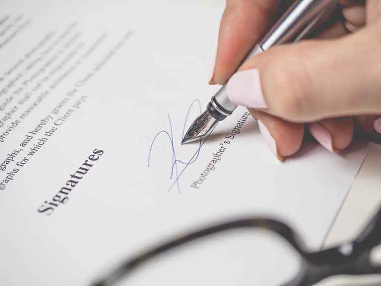 Which legal considerations are involved in contract drafting and negotiation in SAIF Zone?