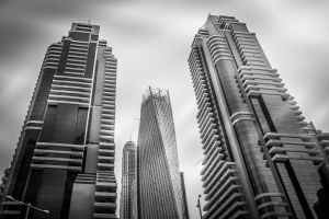 grayscale photo of high rise buildings