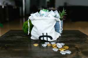 money on a tote bags and coins on the table