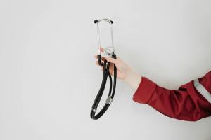 person holding a stethoscope
